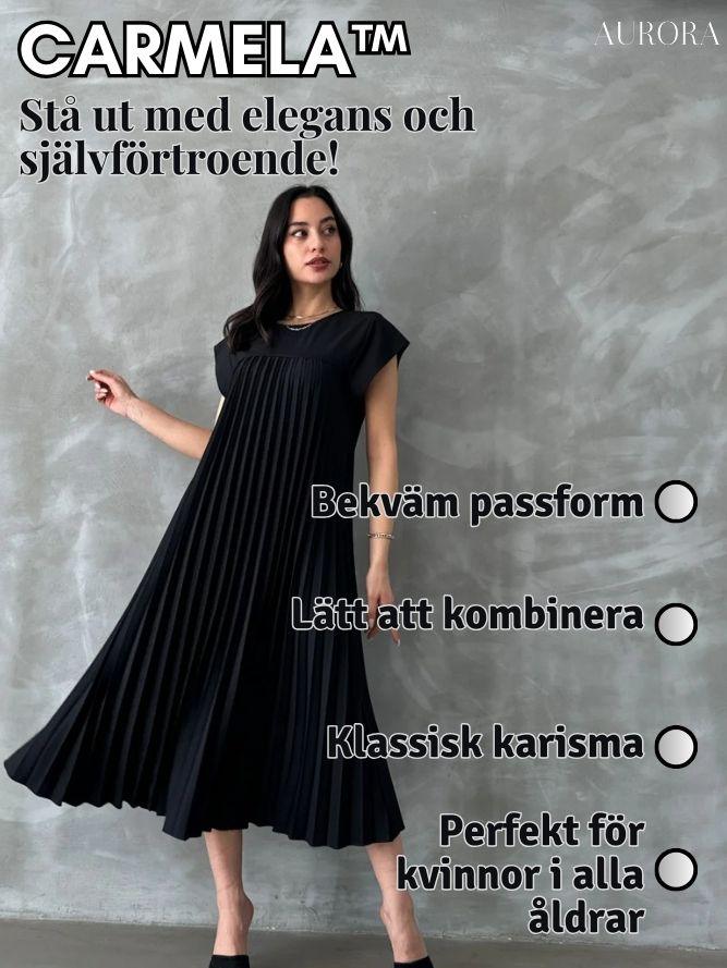 Carmelaâą | Ărmlös, plisserad, enfĂ€rgad klĂ€nning | 50% RABATT TILLFĂLLIGT - Aurora Stockholm